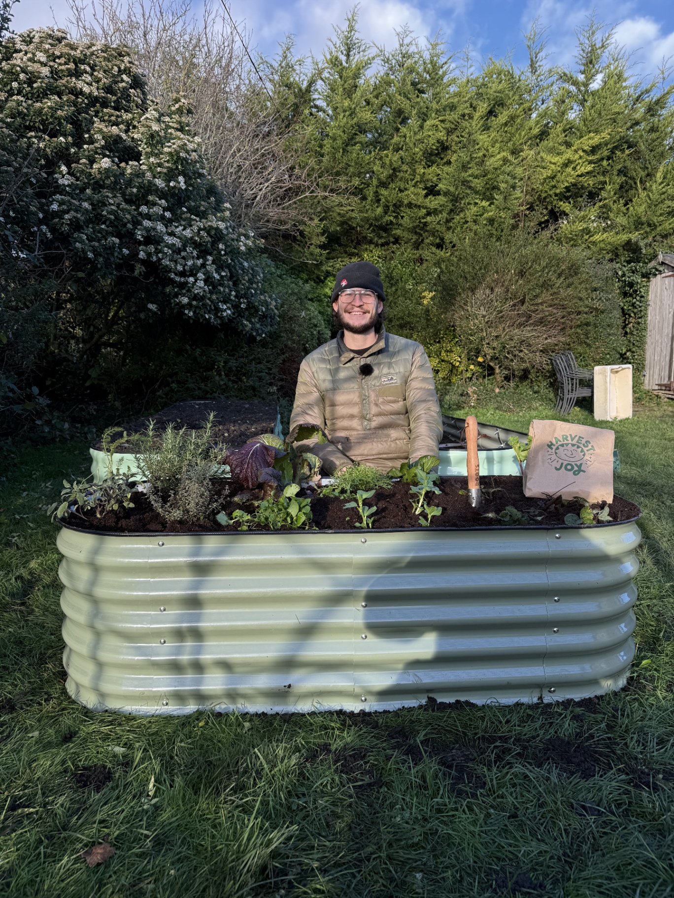 YIMBY raised bed with founder in sunny garden